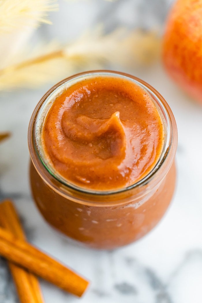 Bird's eye view of a jar filled with apple butter.