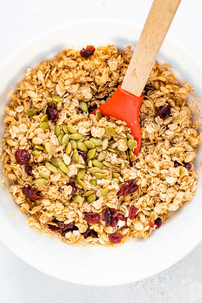 Mixing bowl with ingredients to make pumpkin spice granola bars.