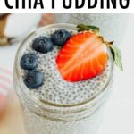 Mason jar of chia pudding topped with blueberries and strawberries.