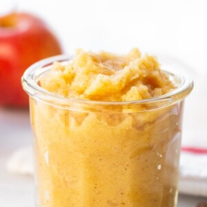 Glass jar of homemade applesauce.