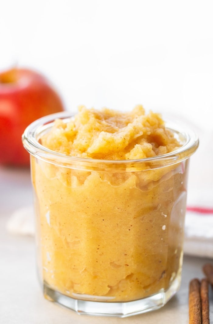 Glass jar of homemade applesauce.