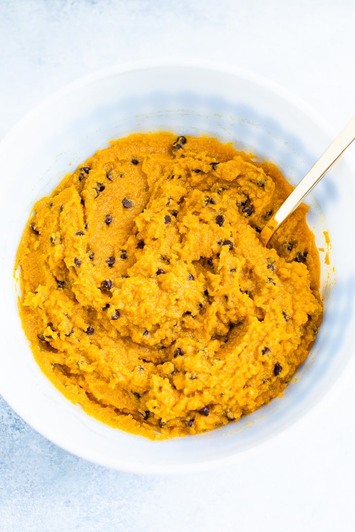 Mixing bowl with pumpkin chocolate chip cookie batter.