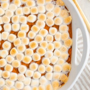 Sweet potato casserole topped with marshmallows.