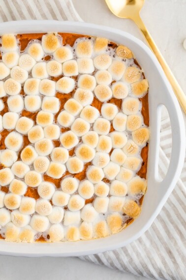 Sweet potato casserole topped with marshmallows.