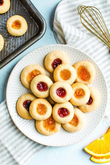 Thumbprint cookies on a plate.