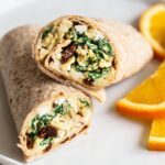 Wrap with eggs, spinach, sun-dried tomatoes and hummus.