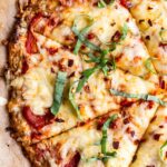 Close up photo of cheese cauliflower crust pizza.