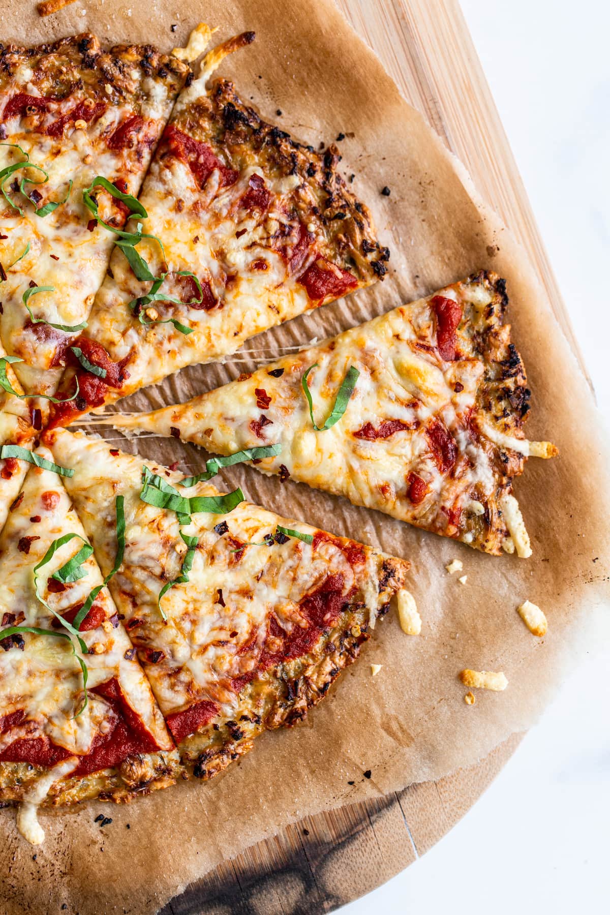 Cauliflower pizza cut into slices.