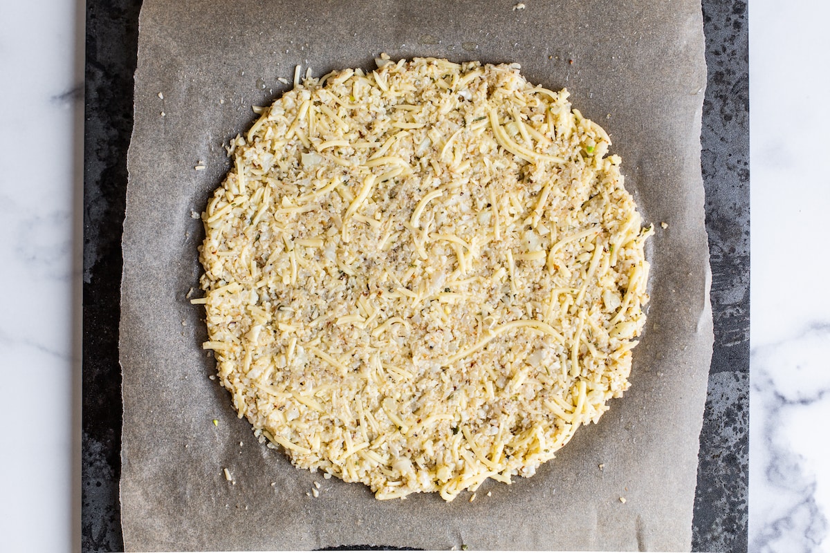 Cauliflower pizza crust before being baked.