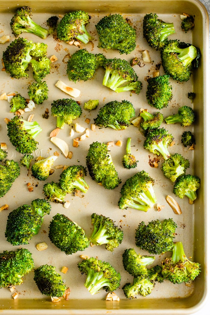 Sheet pan with roasted broccoli and garlic.