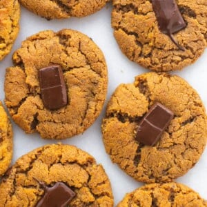 Peanut butter blossom cookies next to each other on a table.