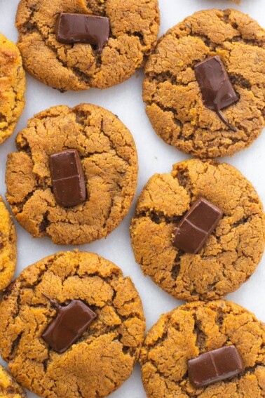 Peanut butter blossom cookies next to each other on a table.