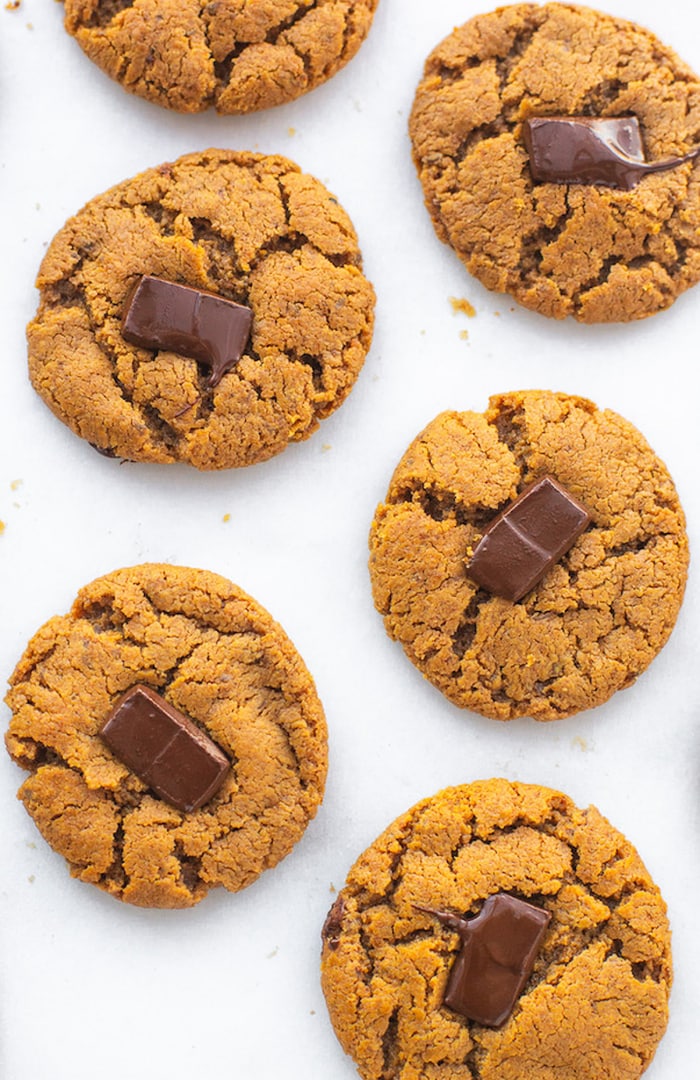 6 peanut butter blossom cookies on a white counter top.