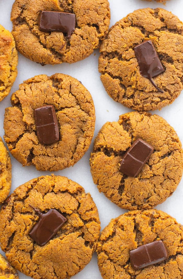 Peanut butter blossom cookies next to each other on a table.