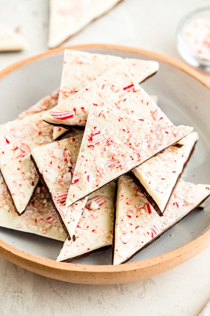 Triangles of peppermint bark in a bowl.
