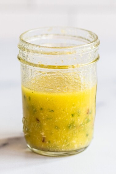 Mason jar with horseradish salad dressing.