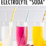Three glasses of electrolyte soda: lemon lime, grape and orange.
