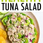 Tuna salad on an open face sandwich with lettuce.