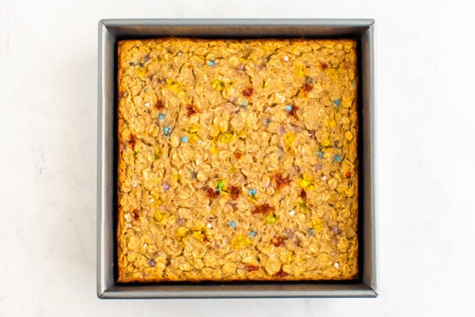 Square baking pan with baked birthday cake oatmeal.