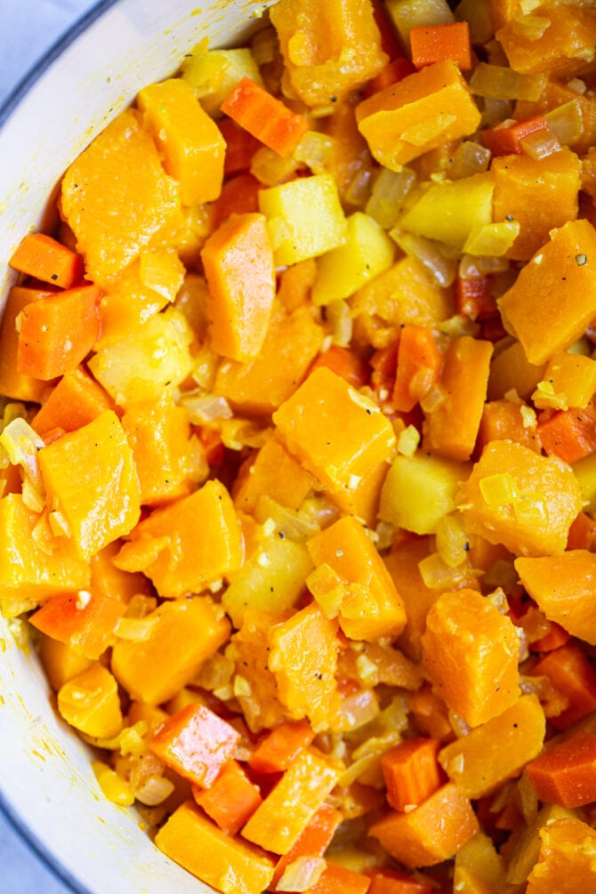 Cubes of butternut squash in a dutch oven.