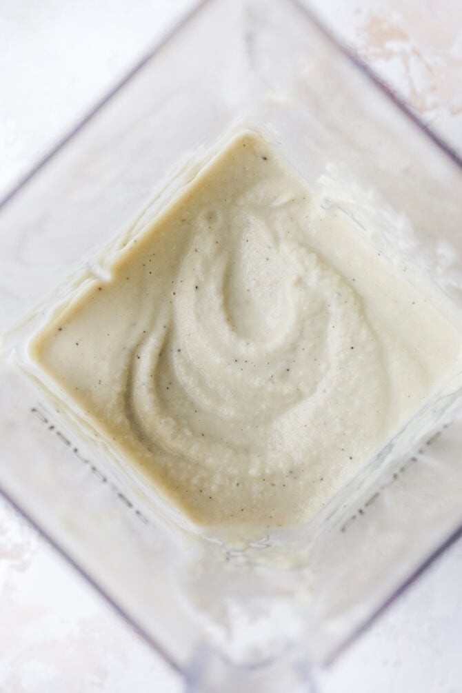 Smooth and creamy cauliflower alfredo sauce in a blender.