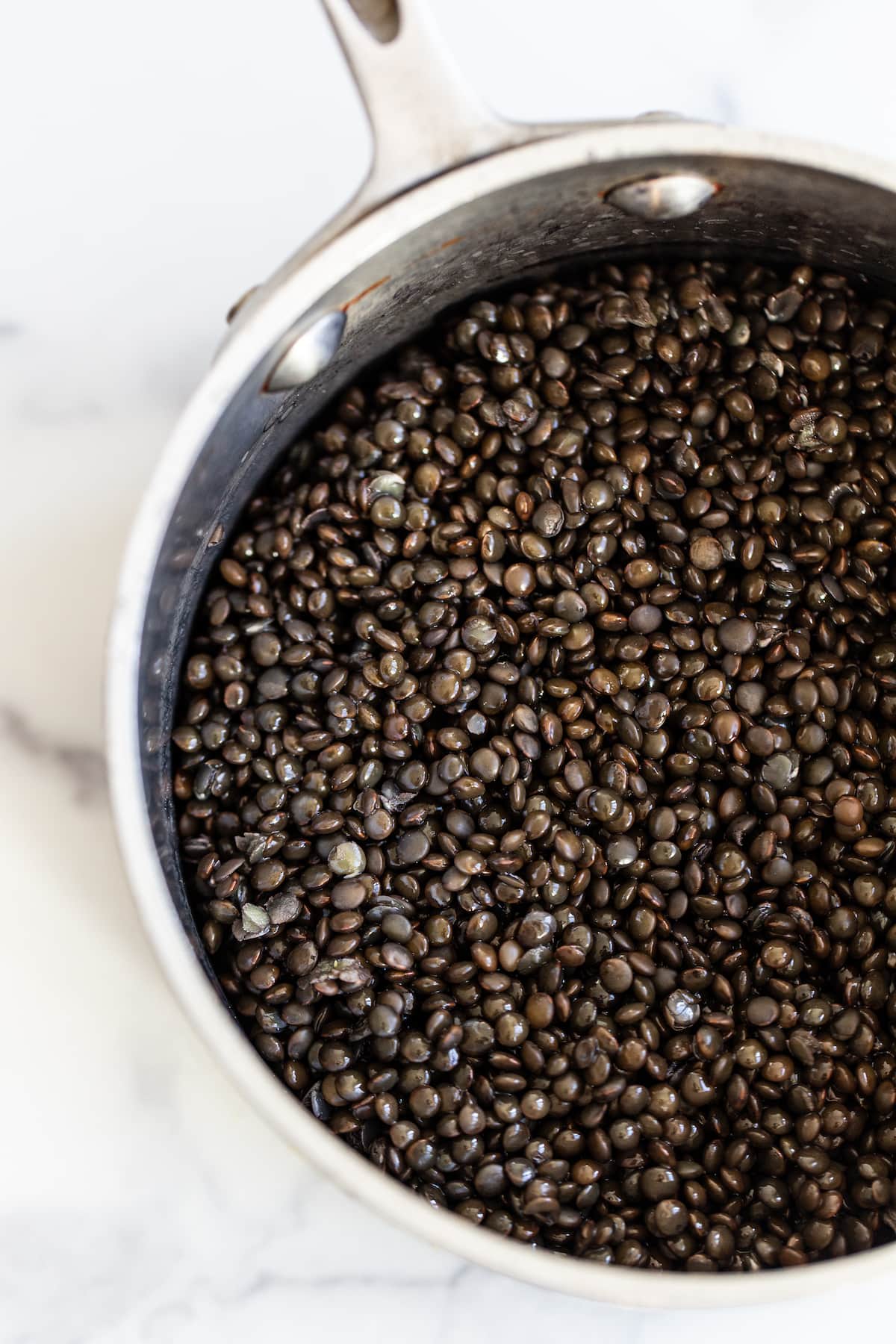 Pot with cooked lentils.