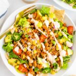 This healthy taco salad is made with ground turkey taco meat instead of beef and is packed with veggies. It comes together quickly making it perfect for a weeknight meal.