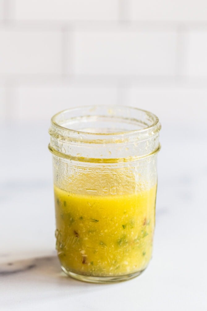 Mason jar with homemade horseradish dressing.