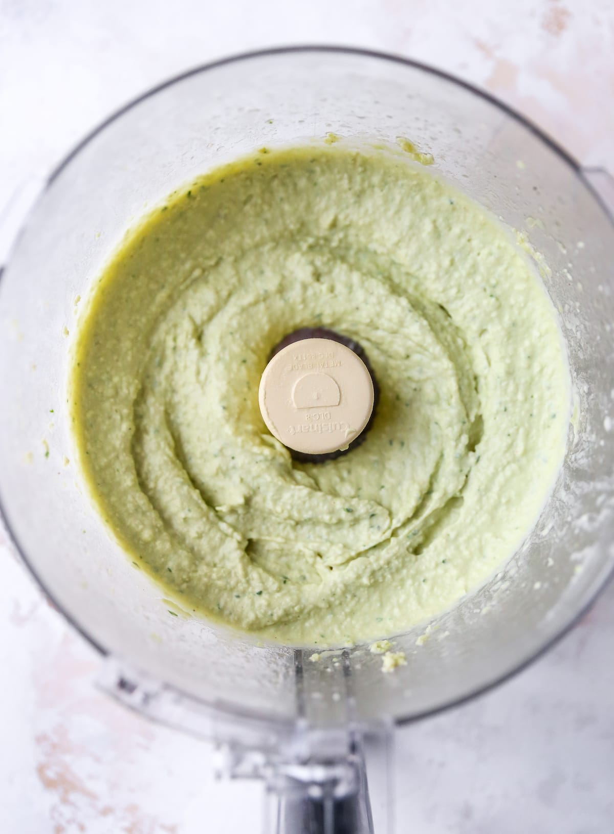 Lima bean hummus blended in a food processor.