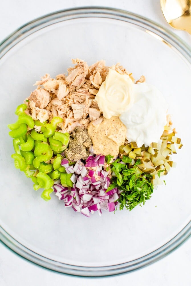 Mixing bowl with ingredients to make tuna salad.