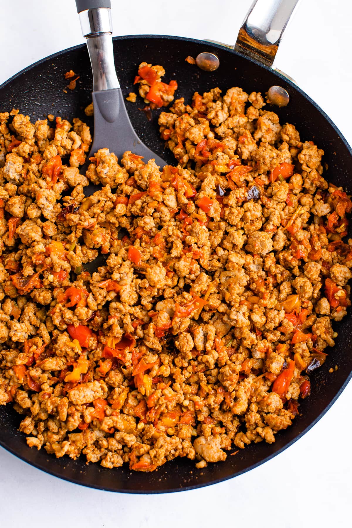 Ground turkey taco meat cooking in a skillet.