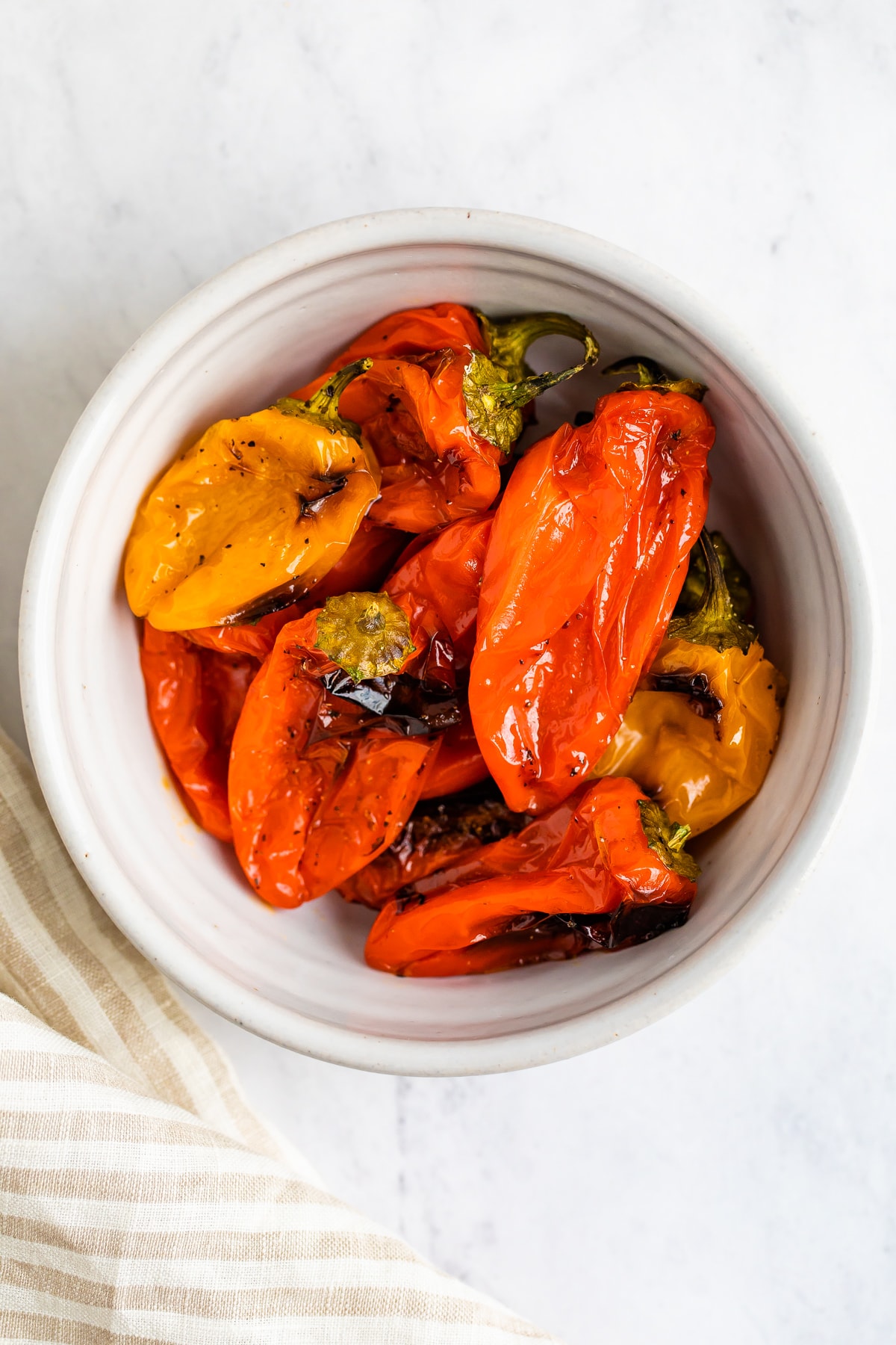 Roasted peppers in a bowl.