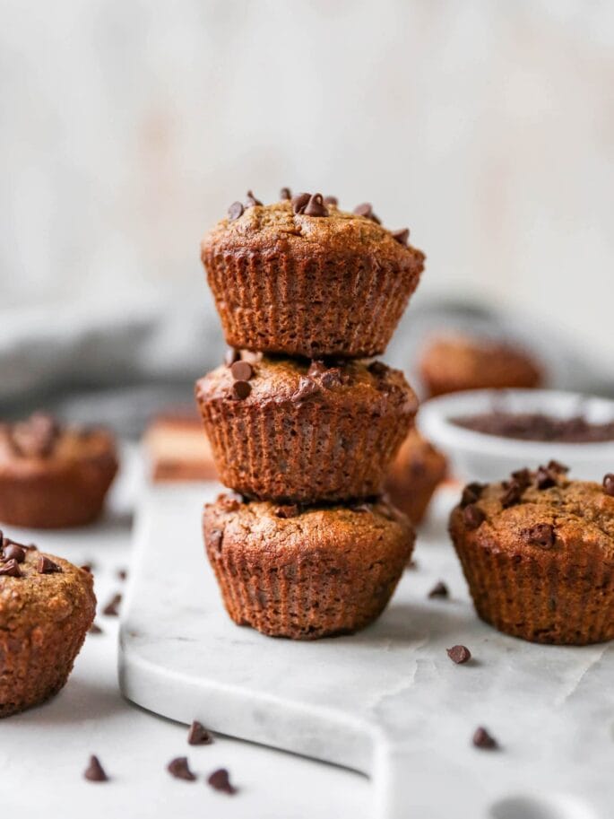 Stack of three almond flour chocolate chip muffins.