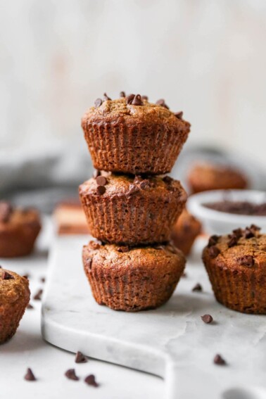 Stack of three almond flour chocolate chip muffins.