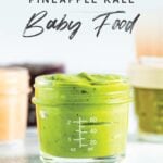 Jar of homemade avocado peach pineapple kale baby food.