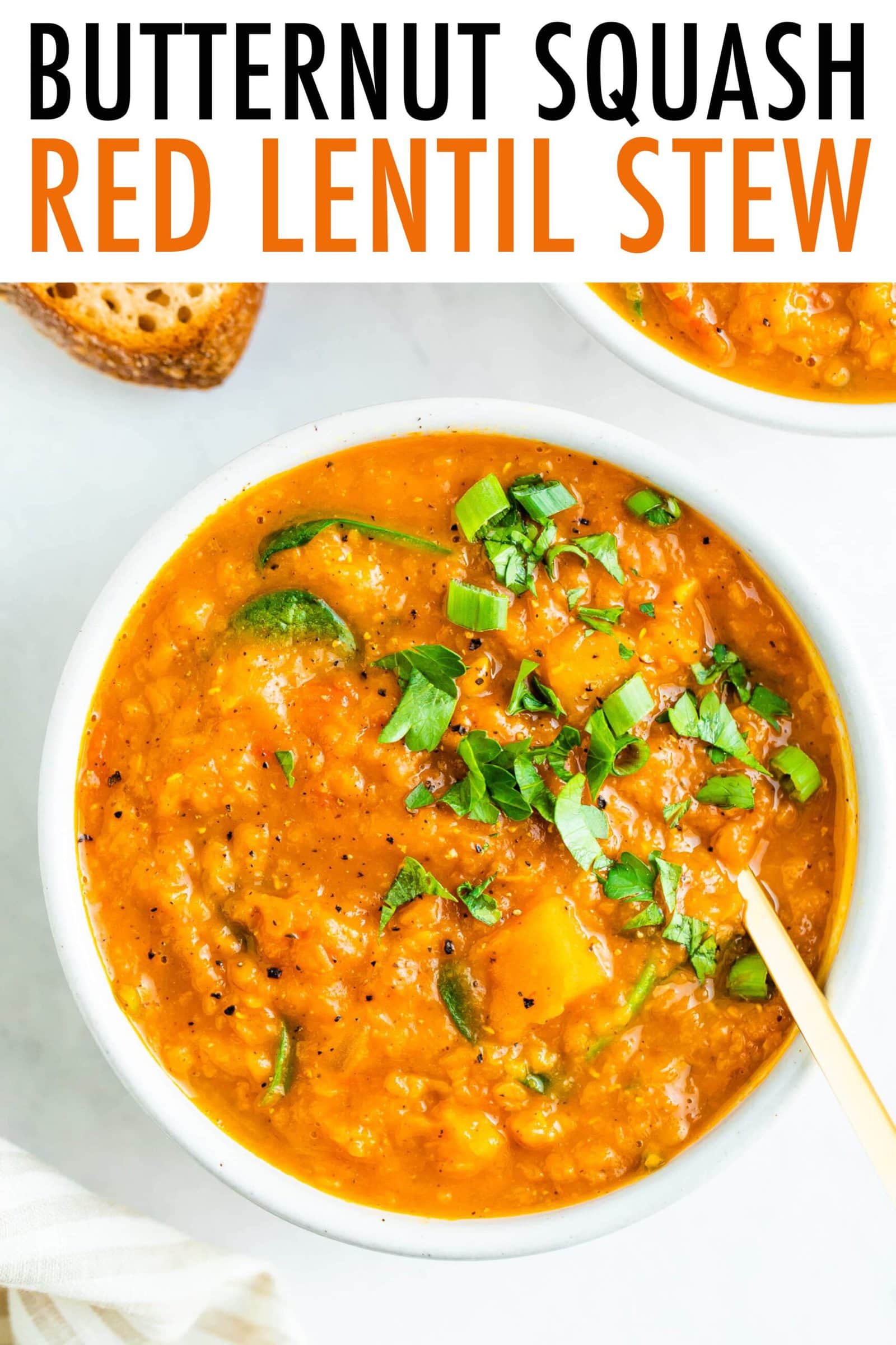 Bowl of butternut squash lentil stew topped with parsley.