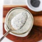 Spoon with poppyseed dressing.