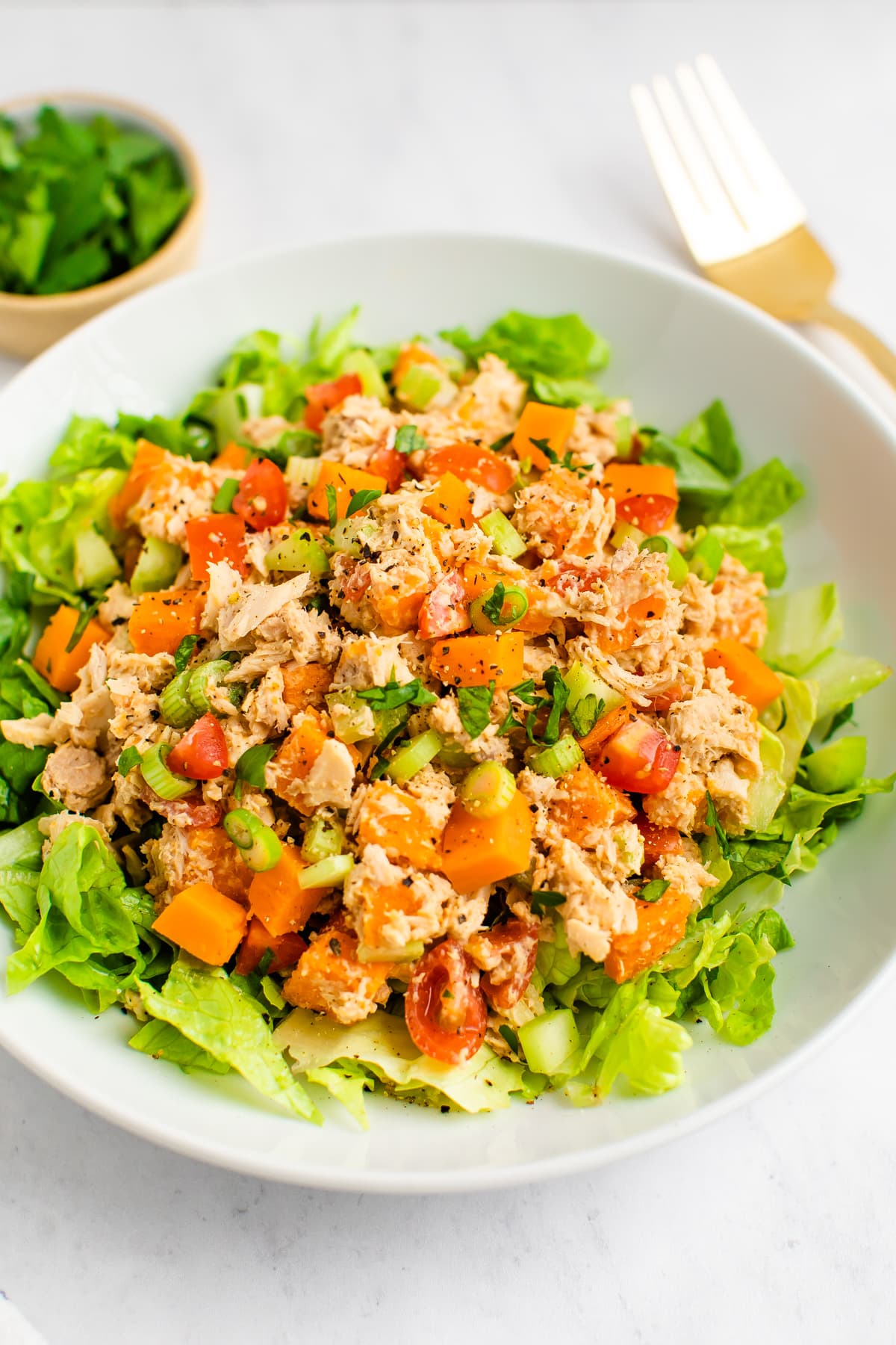 Sweet potato tuna salad served on a bed of lettuce.