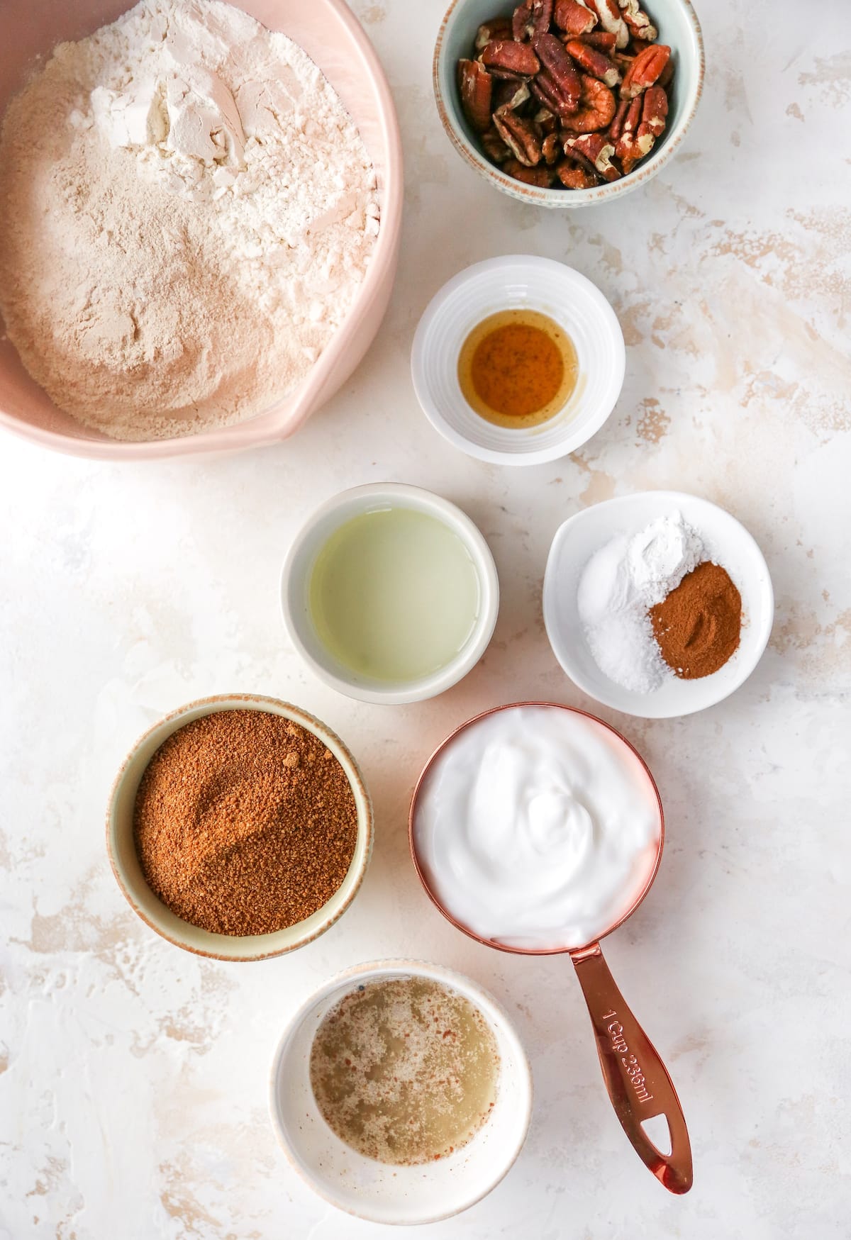 Ingredients to make coffee cake measured out into bowls and measuring cups.