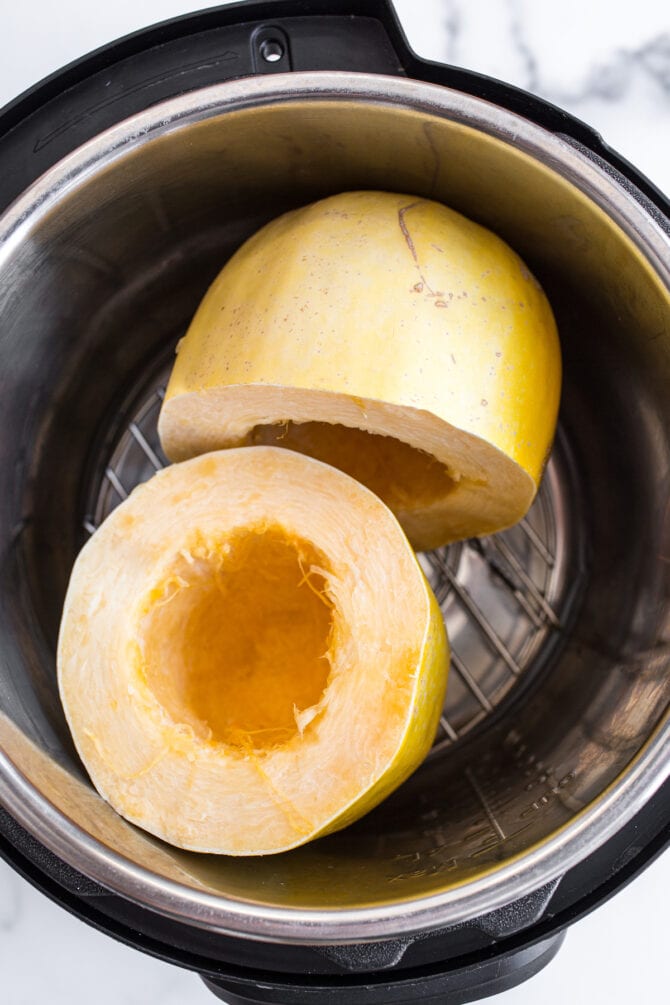 Two halves of spaghetti squash in an instant pot.