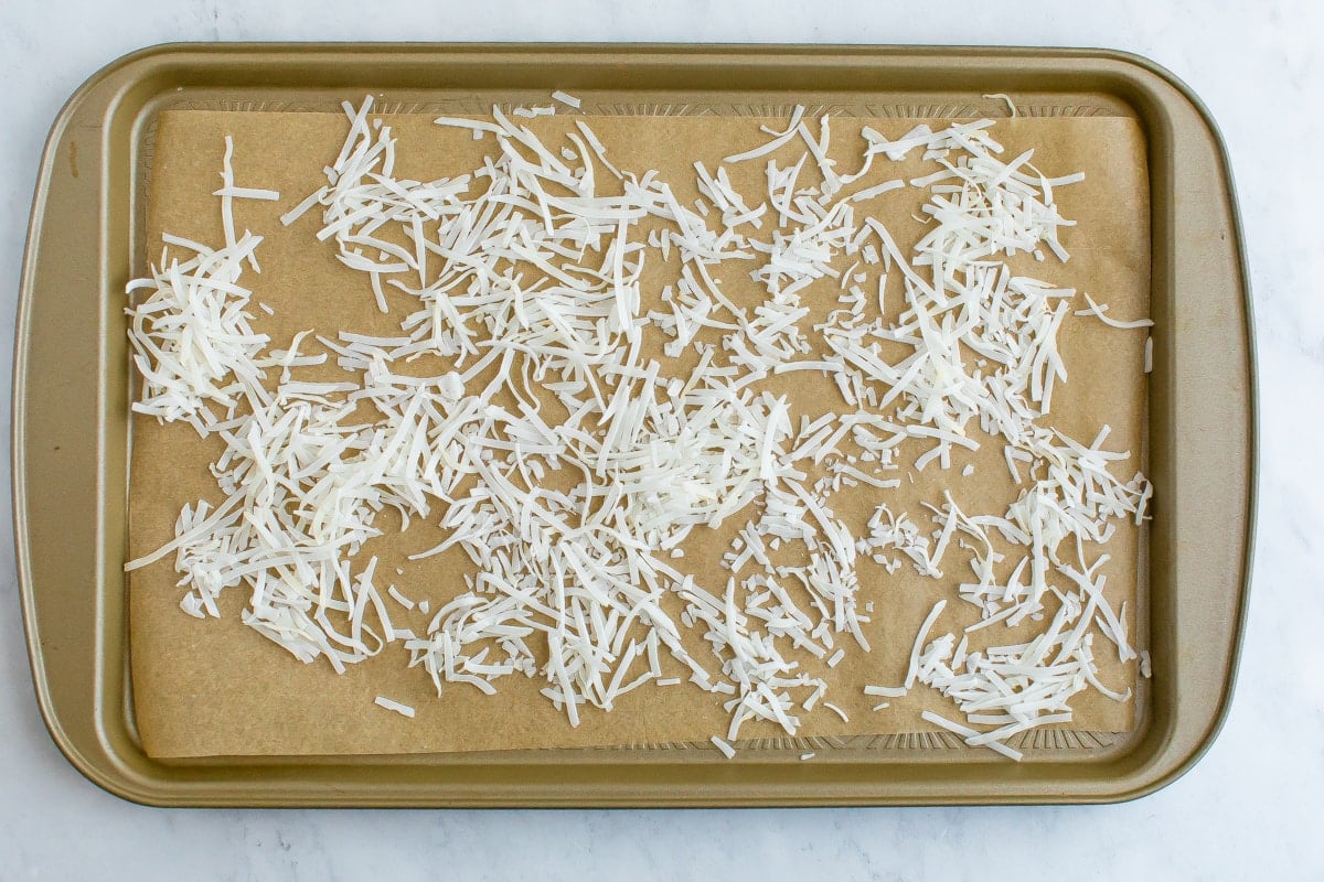 Sheet pan with coconut flakes.
