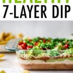 Side view of a glass dish of Mexican layer dip so you can see the layers.