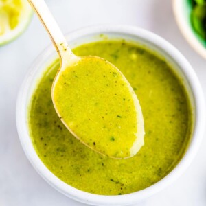 Spoon with a spoonful of cilantro lime dressing.