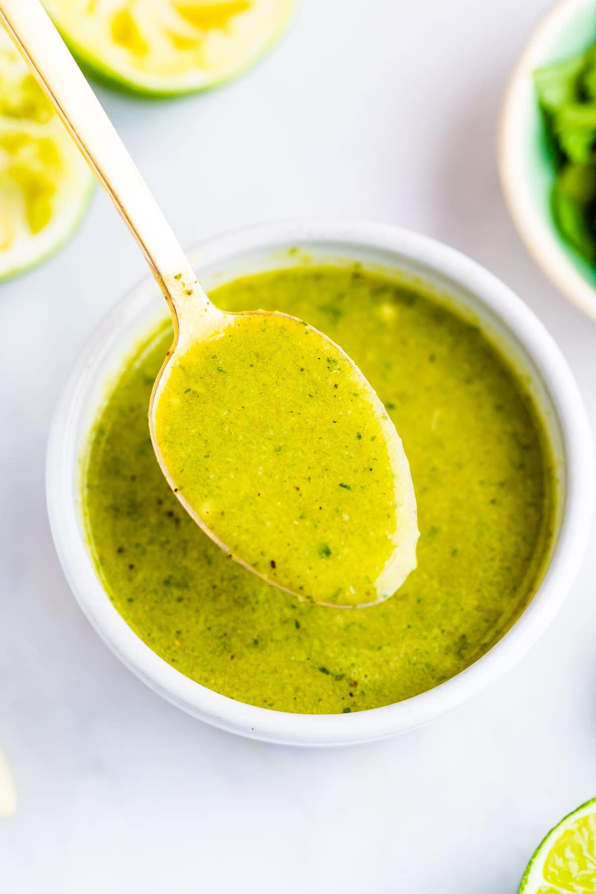 Spoon with a spoonful of cilantro lime dressing.