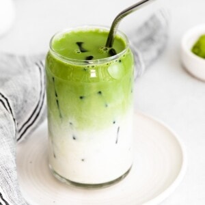 Iced Matcha Latte with a metal straw.