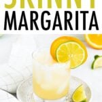 Glass with a margarita garnished with lime orange slices.