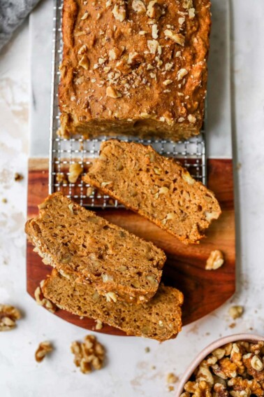 Loaf of banana bread with slices taken out of it.