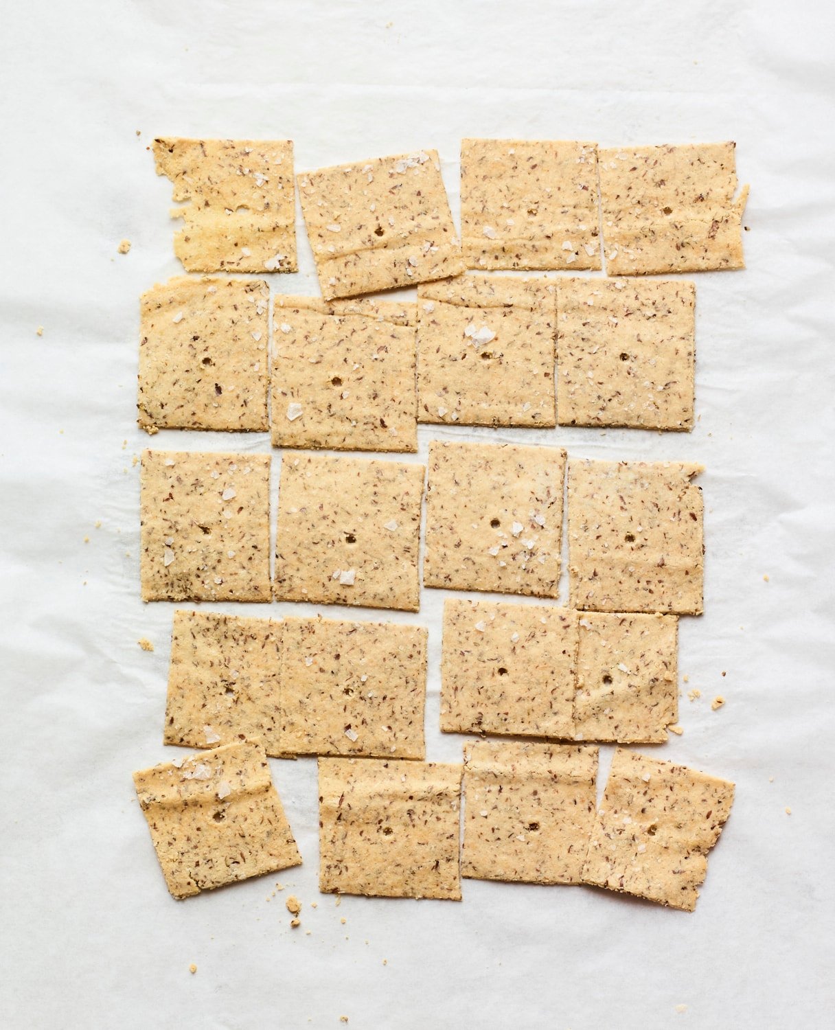 Almond crackers on parchment paper.