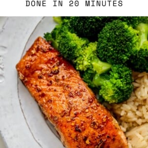 Plate with a piece of balsamic salmon, brown rice and broccoli.