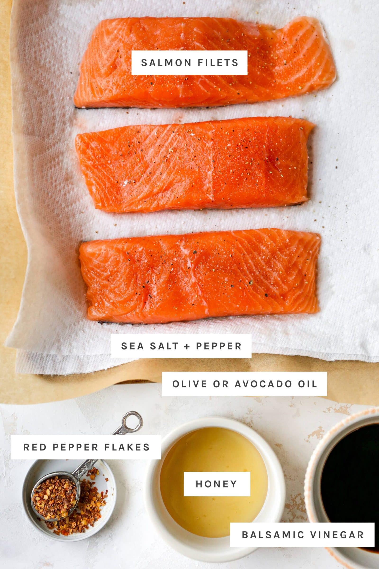 Three filets of raw salmon sprinkled with salt and pepper and bowls of red pepper, honey and balsamic vinegar.